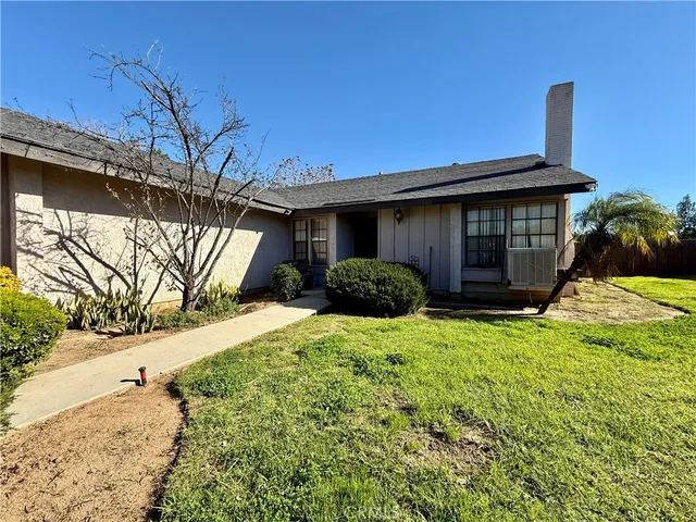 a living room with furniture and fireplace