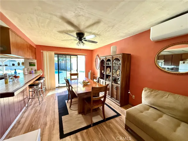 a kitchen with stainless steel appliances granite countertop a refrigerator a sink a stove and a microwave oven