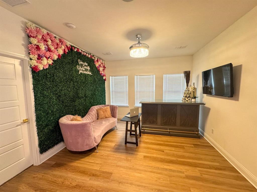 7024 Tree Stand Point Little Elm, TX 76227 - Photo 5 of 30 a living room with fireplace furniture and a flat screen tv