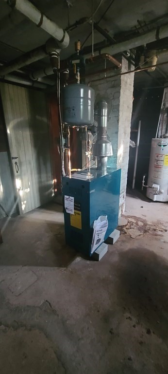 229 Cory Street Fall River, MA 02720 - Photo 27 of 30 a room with lots of water heater and other room