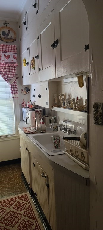 229 Cory Street Fall River, MA 02720 - Photo 3 of 30 a kitchen with stainless steel appliances a sink dishwasher stove and cabinets