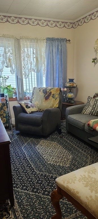 229 Cory Street Fall River, MA 02720 - Photo 9 of 30 a living room with a couch and a table