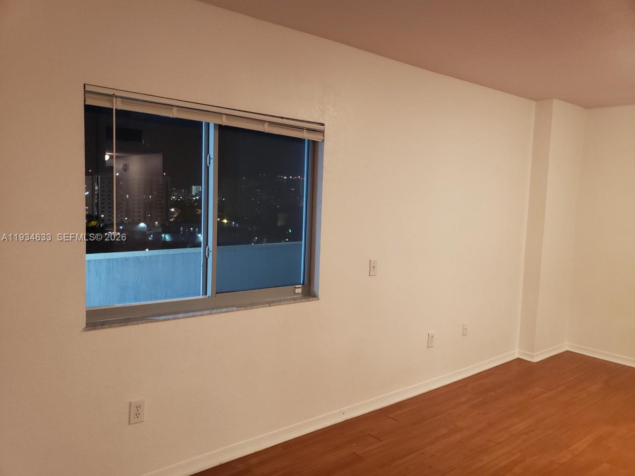 36 Northwest 6th Avenue, Unit 906 Miami, FL 33128 - Photo 15 of 37 an empty room with window