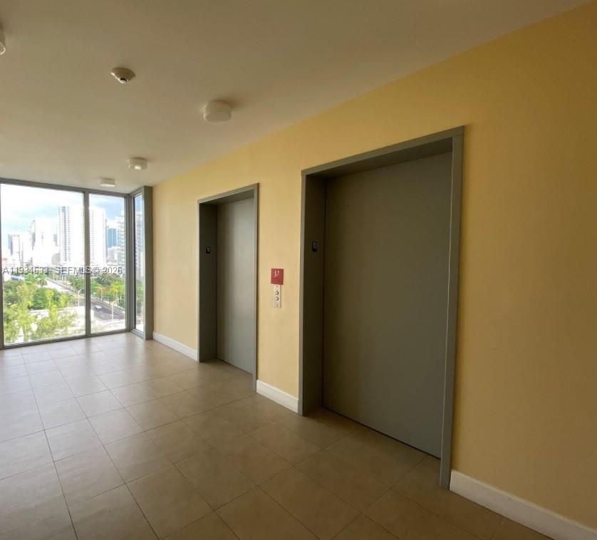 36 Northwest 6th Avenue, Unit 906 Miami, FL 33128 - Photo 27 of 37 a view of an empty room with a window