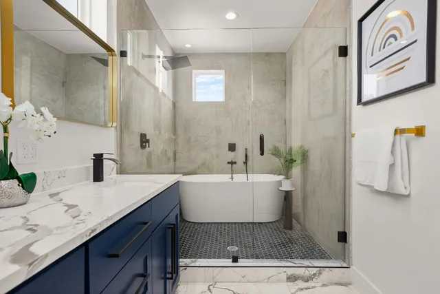 a white bath tub sitting in a bathroom