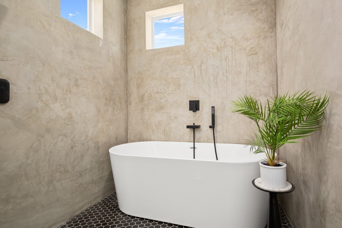 1606 Harvey Street, Unit 1 Austin, TX 78702 - Photo 16 of 33 a white bath tub sitting in a bathroom