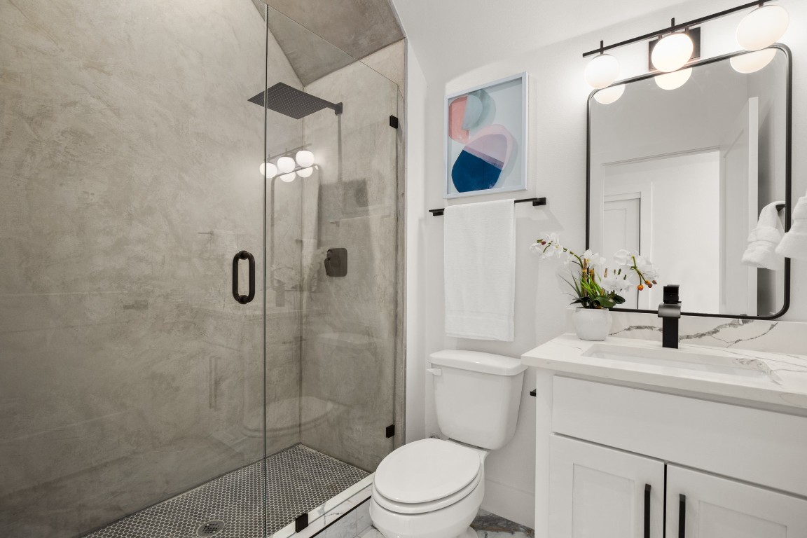 1606 Harvey Street, Unit 1 Austin, TX 78702 - Photo 24 of 33 a bathroom with a sink toilet and shower