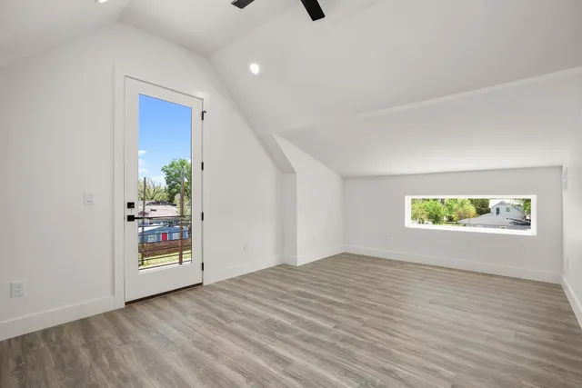 a view of balcony with wooden floor and fence