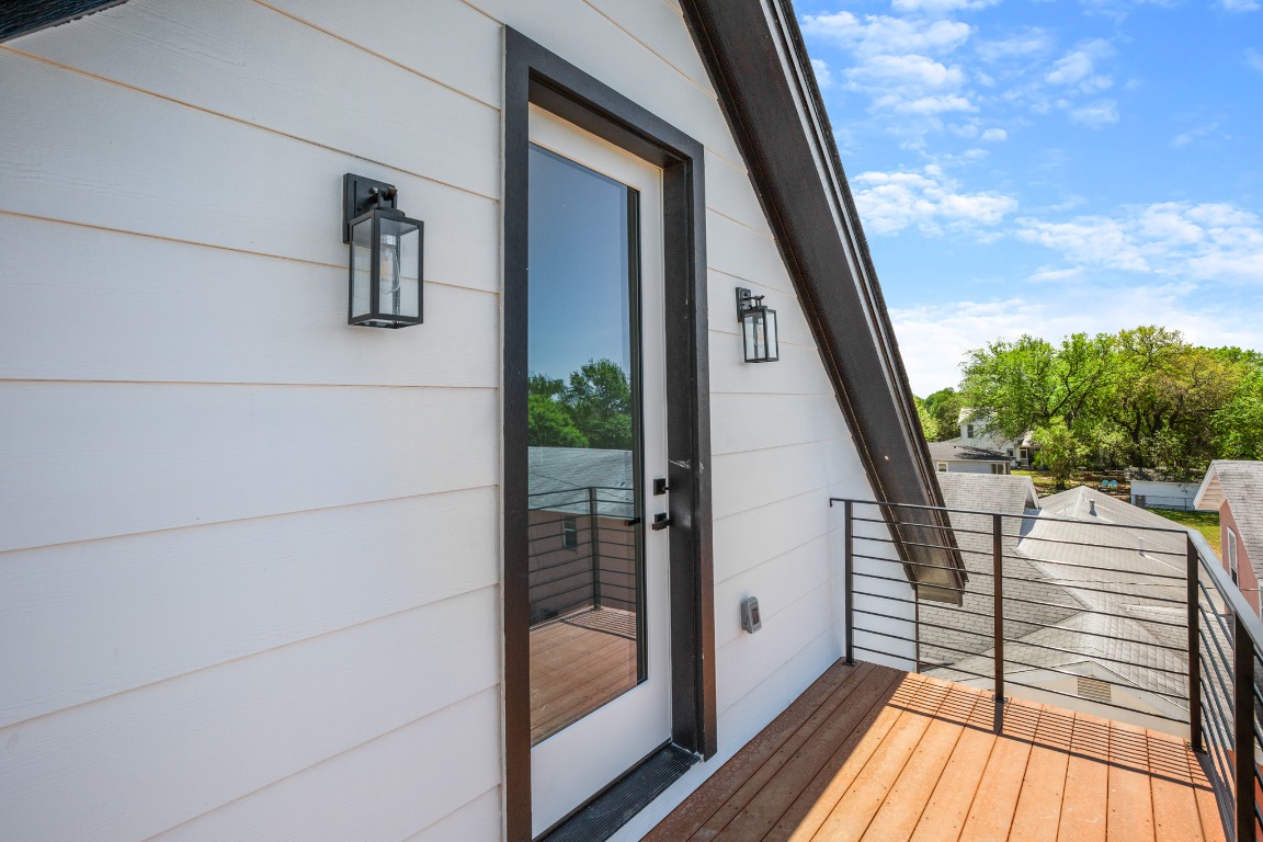 1606 Harvey Street, Unit 1 Austin, TX 78702 - Photo 26 of 33 a view of balcony with wooden floor and fence