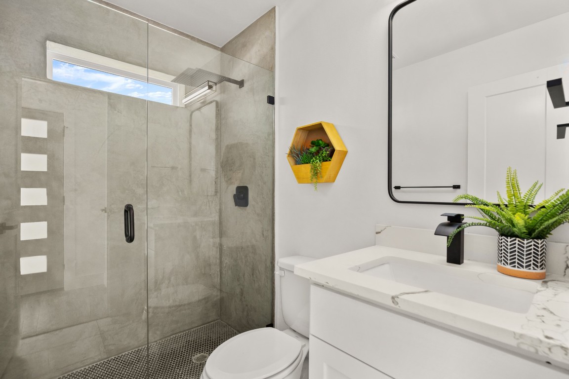 1606 Harvey Street, Unit 1 Austin, TX 78702 - Photo 32 of 33 a bathroom with a sink toilet and shower