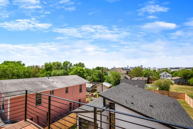 a view of a kitchen counter top space with furniture and wooden floor