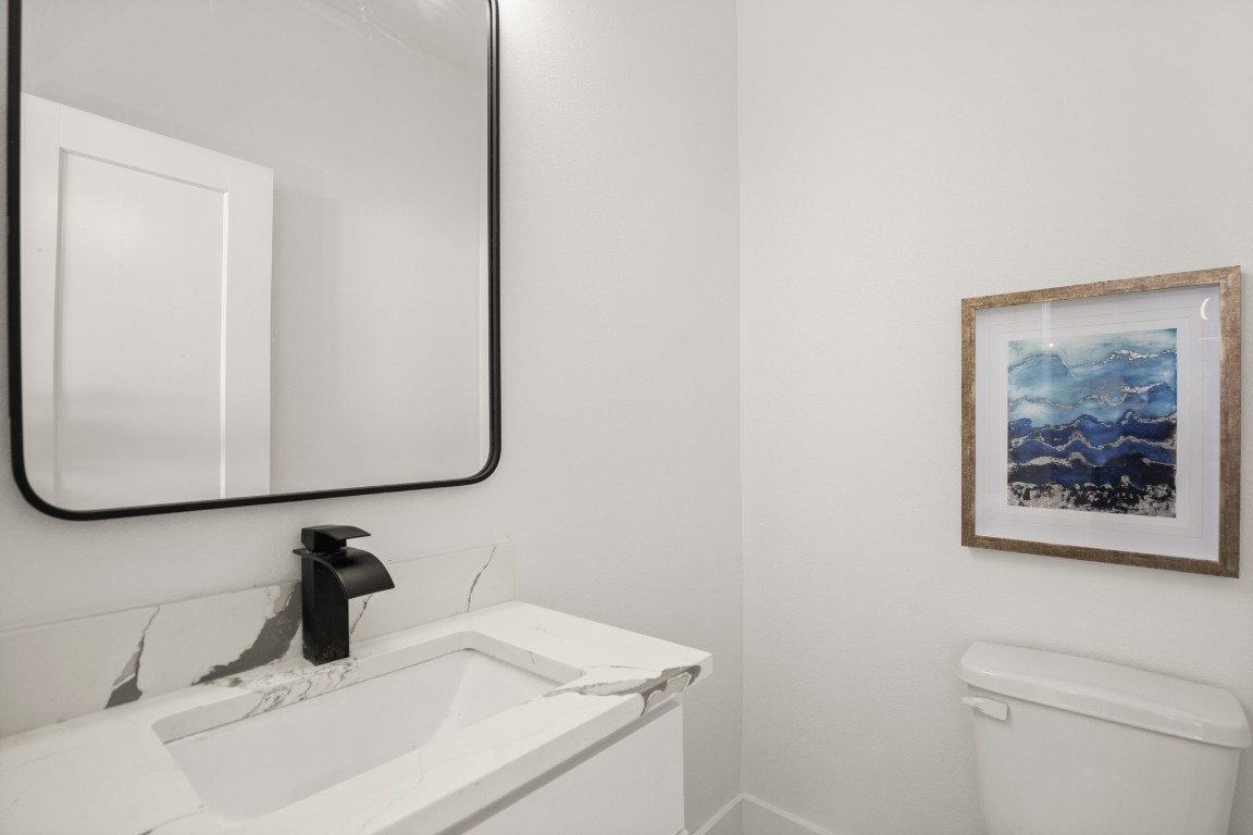 1606 Harvey Street, Unit 1 Austin, TX 78702 - Photo 10 of 33 a bathroom with a sink and a mirror