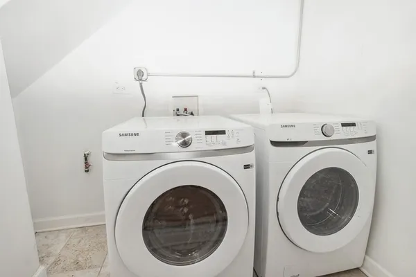 a utility room with dryer and washer