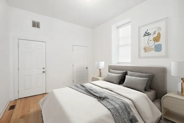 a bedroom with a bed and wall painting