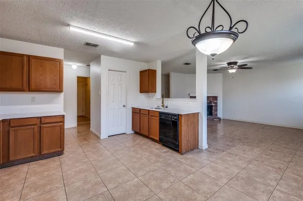 a spacious bathroom with a sink and a mirror