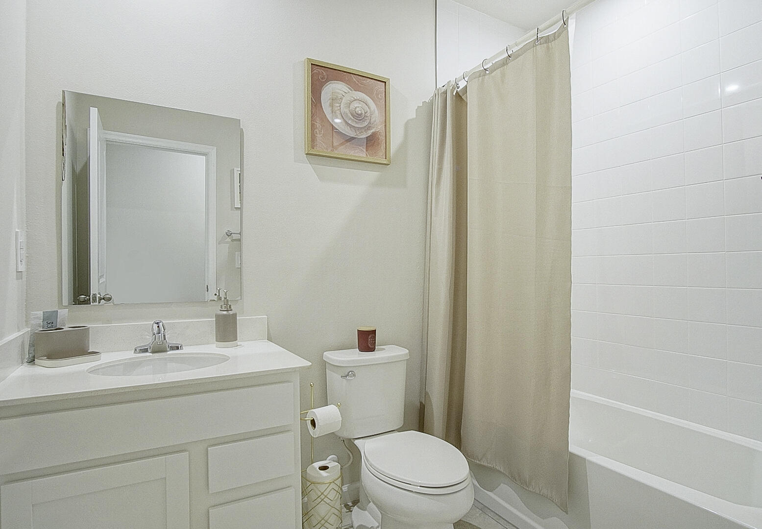 266 Raspberry Road Fort Pierce, FL 34981 - Photo 15 of 34 a bathroom with a sink a mirror a toilet and shower