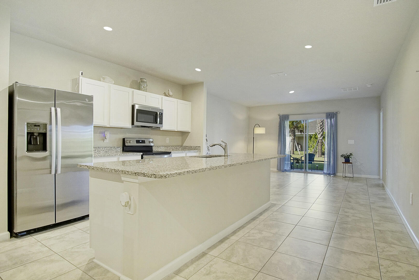 266 Raspberry Road Fort Pierce, FL 34981 - Photo 21 of 34 a large kitchen with stainless steel appliances lots of counter top space and cabinets