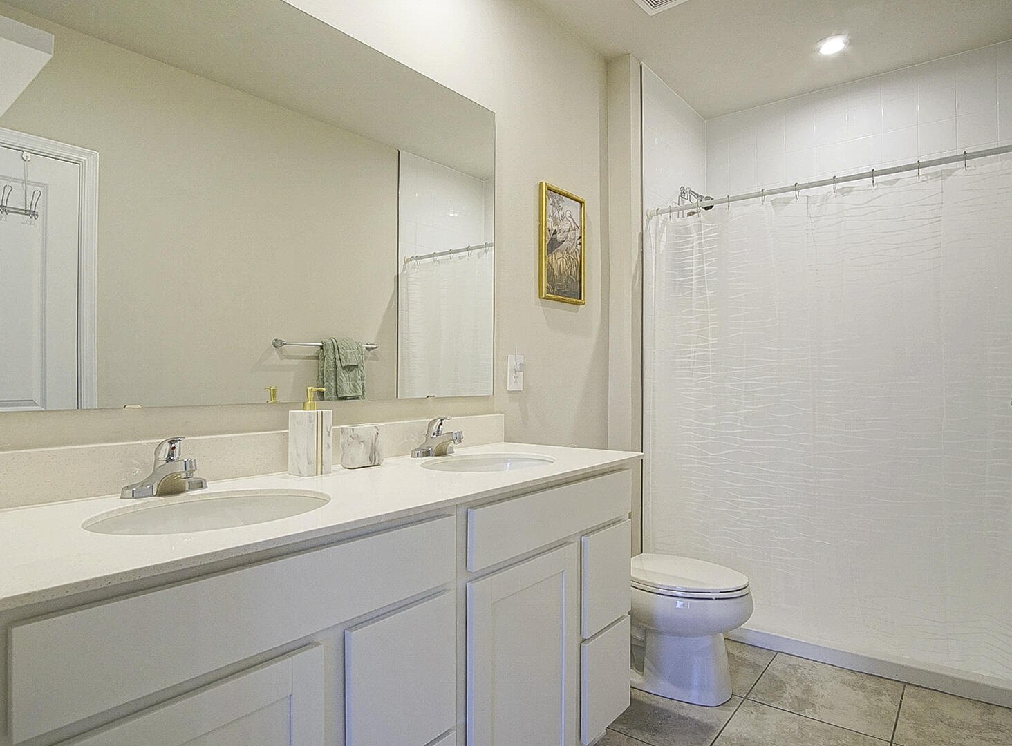 266 Raspberry Road Fort Pierce, FL 34981 - Photo 28 of 34 a bathroom with a sink a toilet and mirror
