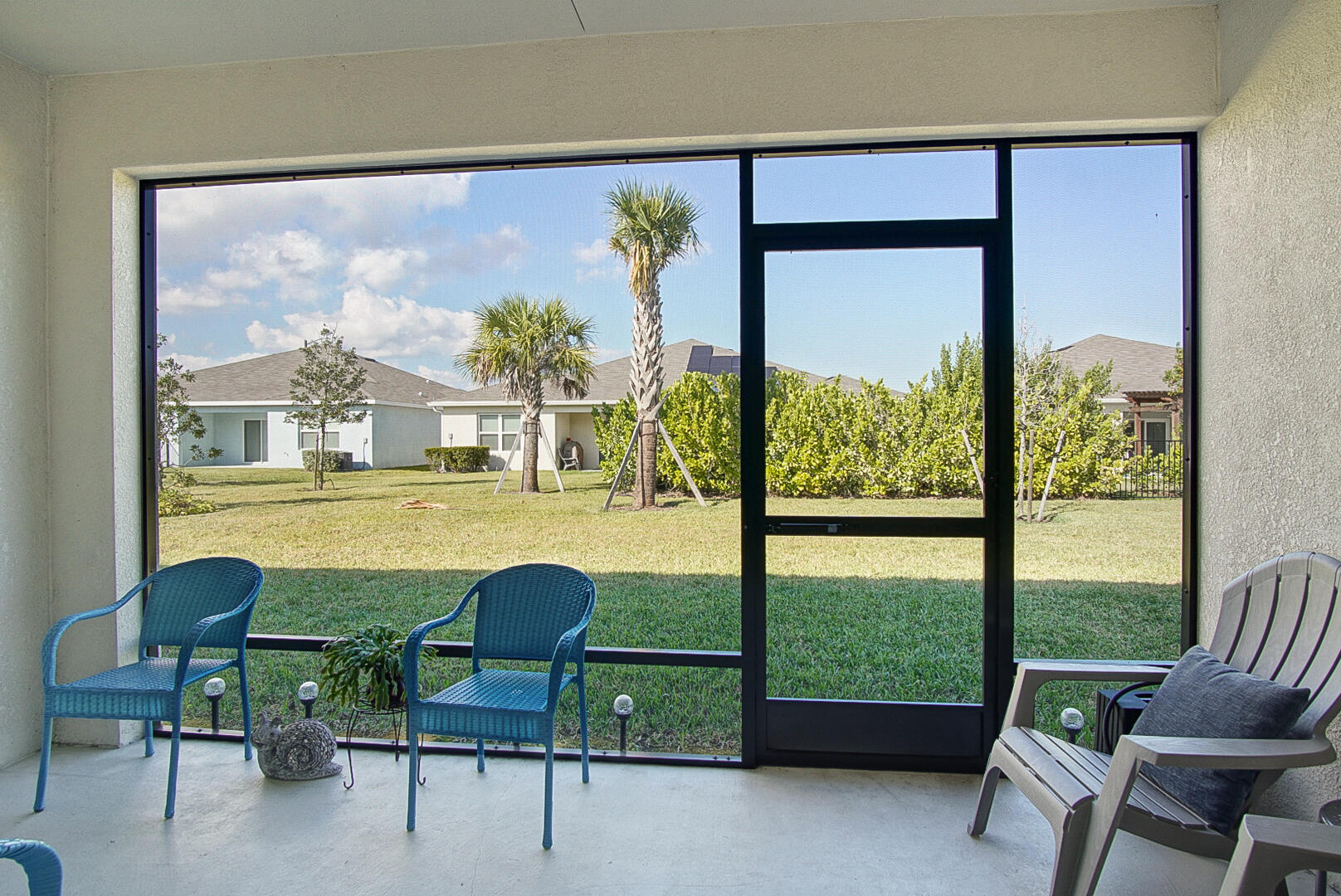 266 Raspberry Road Fort Pierce, FL 34981 - Photo 30 of 34 a view of a room with a large window and chairs