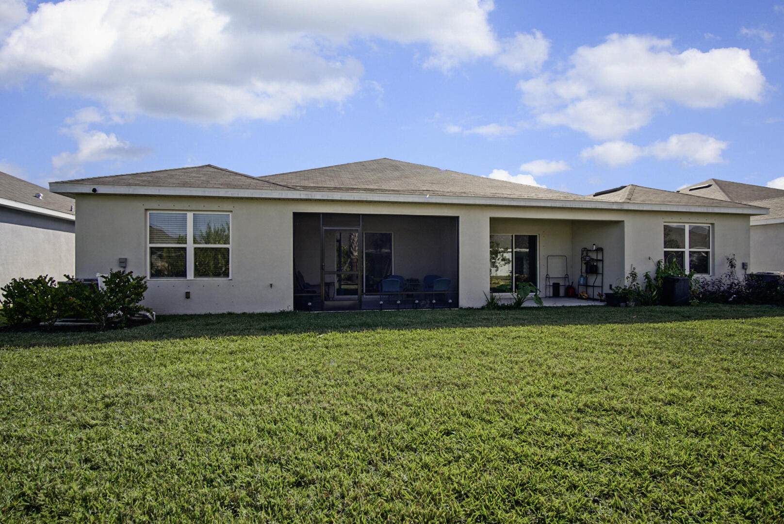 266 Raspberry Road Fort Pierce, FL 34981 - Photo 33 of 34 a front view of a house with a garden