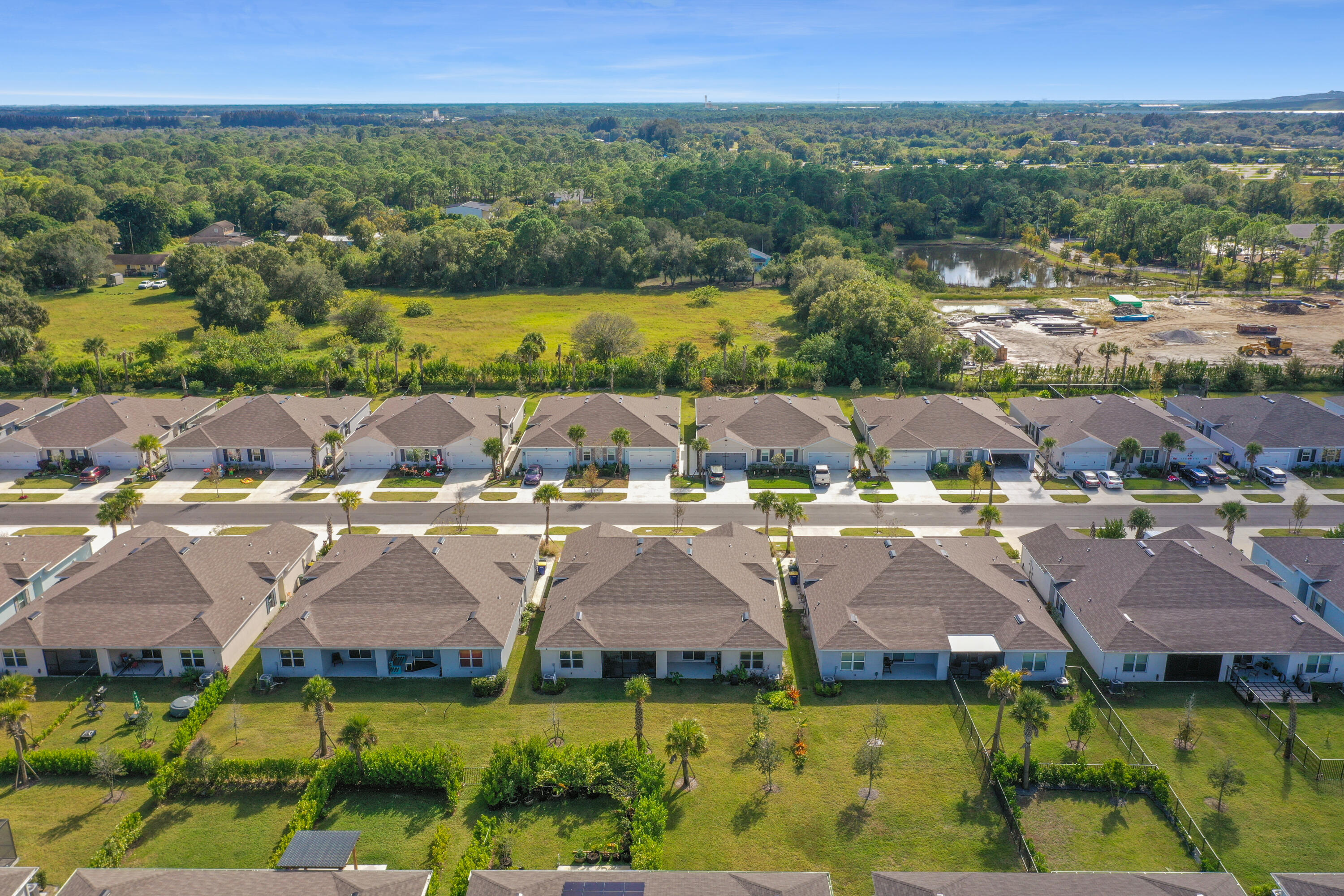 266 Raspberry Road Fort Pierce, FL 34981 - Photo 7 of 34 an aerial view of a house with a garden and lake view