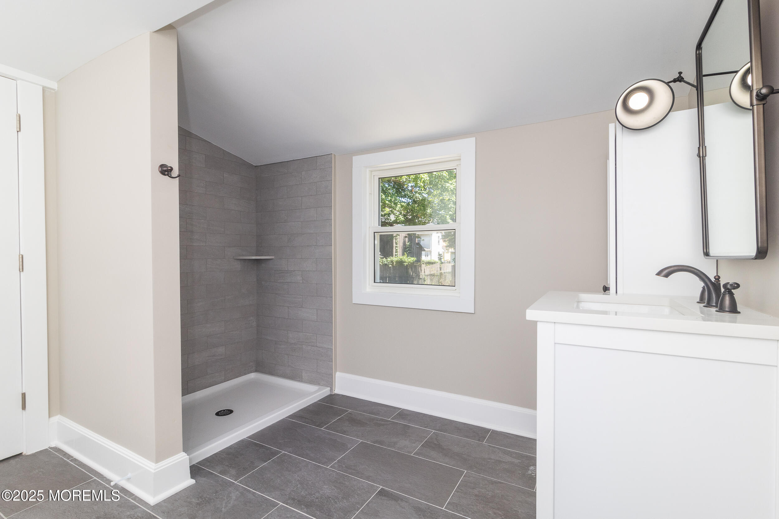 30 Conover Street Freehold, NJ 07728 - Photo 13 of 39 a bathroom with a sink a toilet and shower