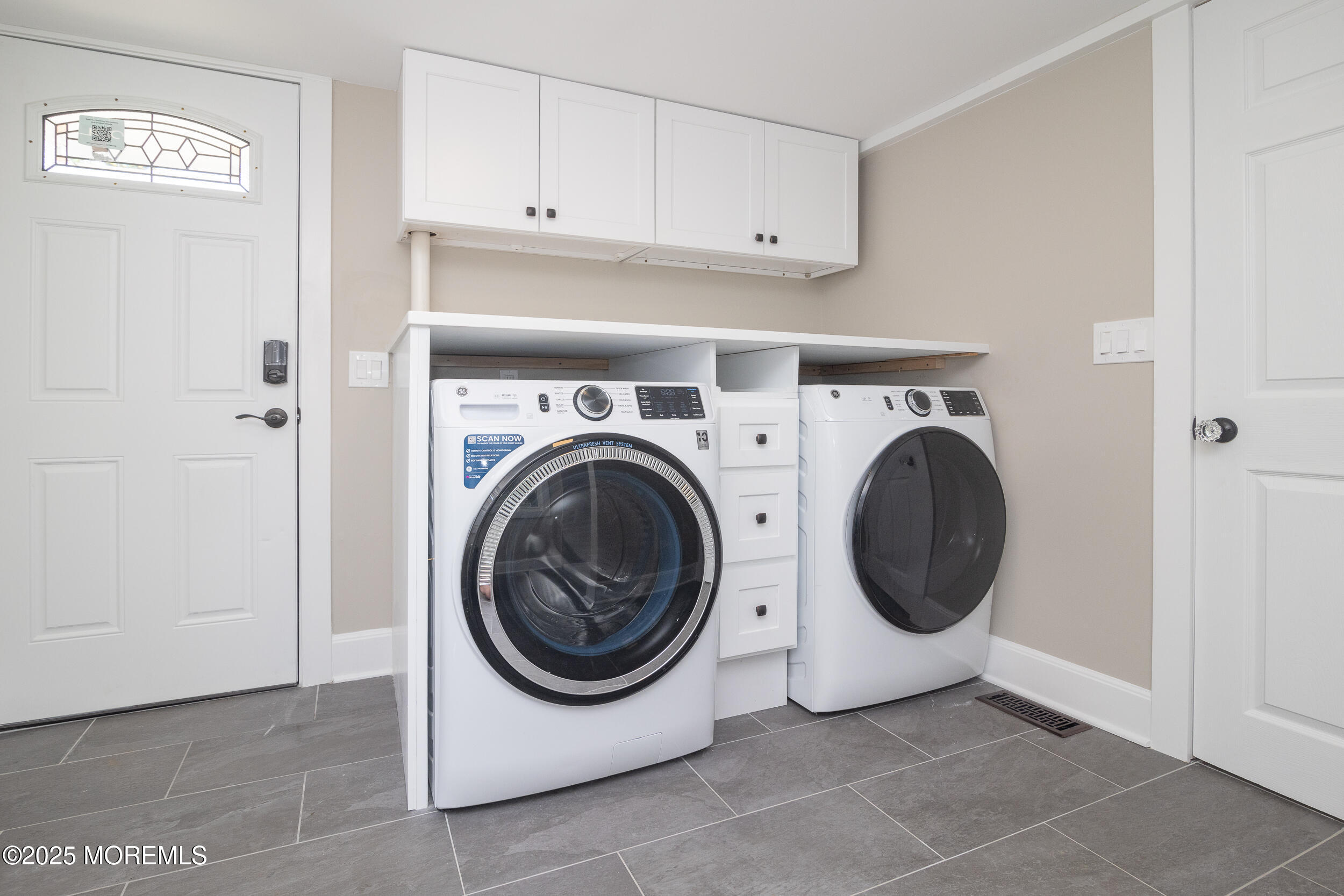 30 Conover Street Freehold, NJ 07728 - Photo 14 of 39 a utility room with dryer and washer
