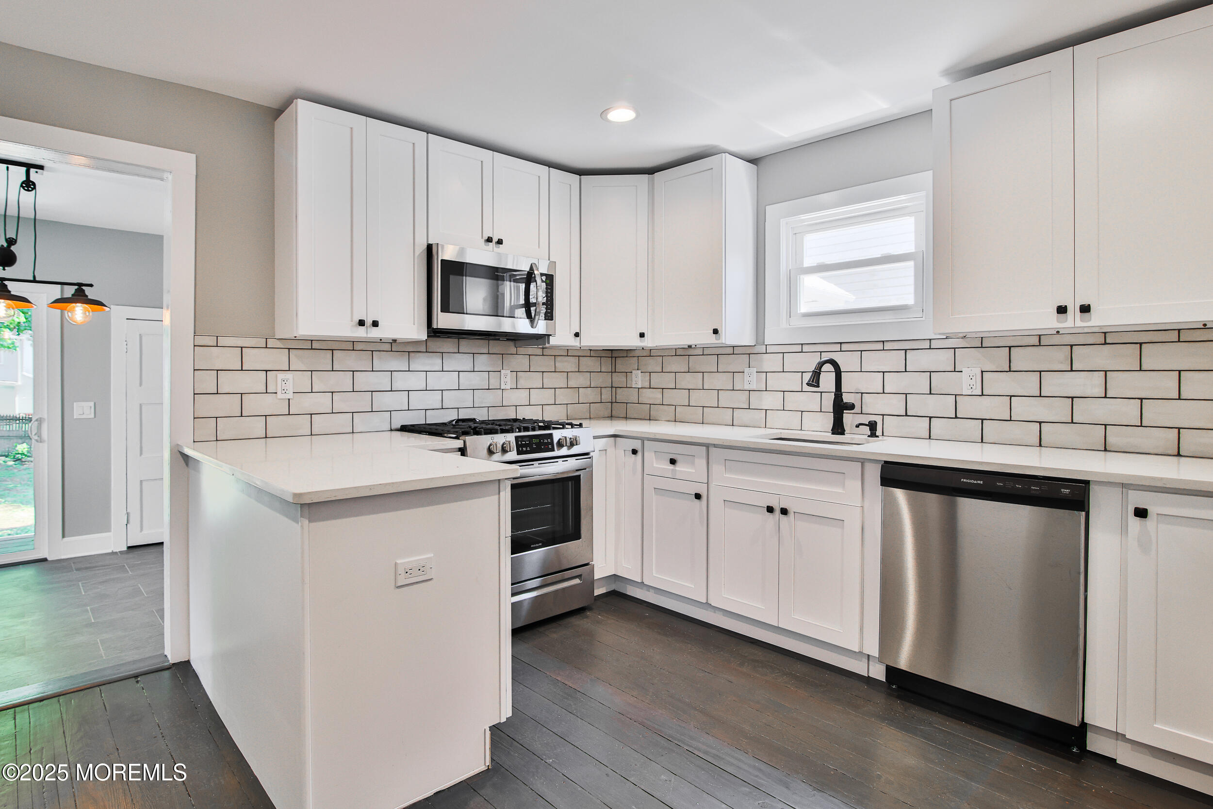 30 Conover Street Freehold, NJ 07728 - Photo 15 of 39 a kitchen with granite countertop white cabinets and white appliances