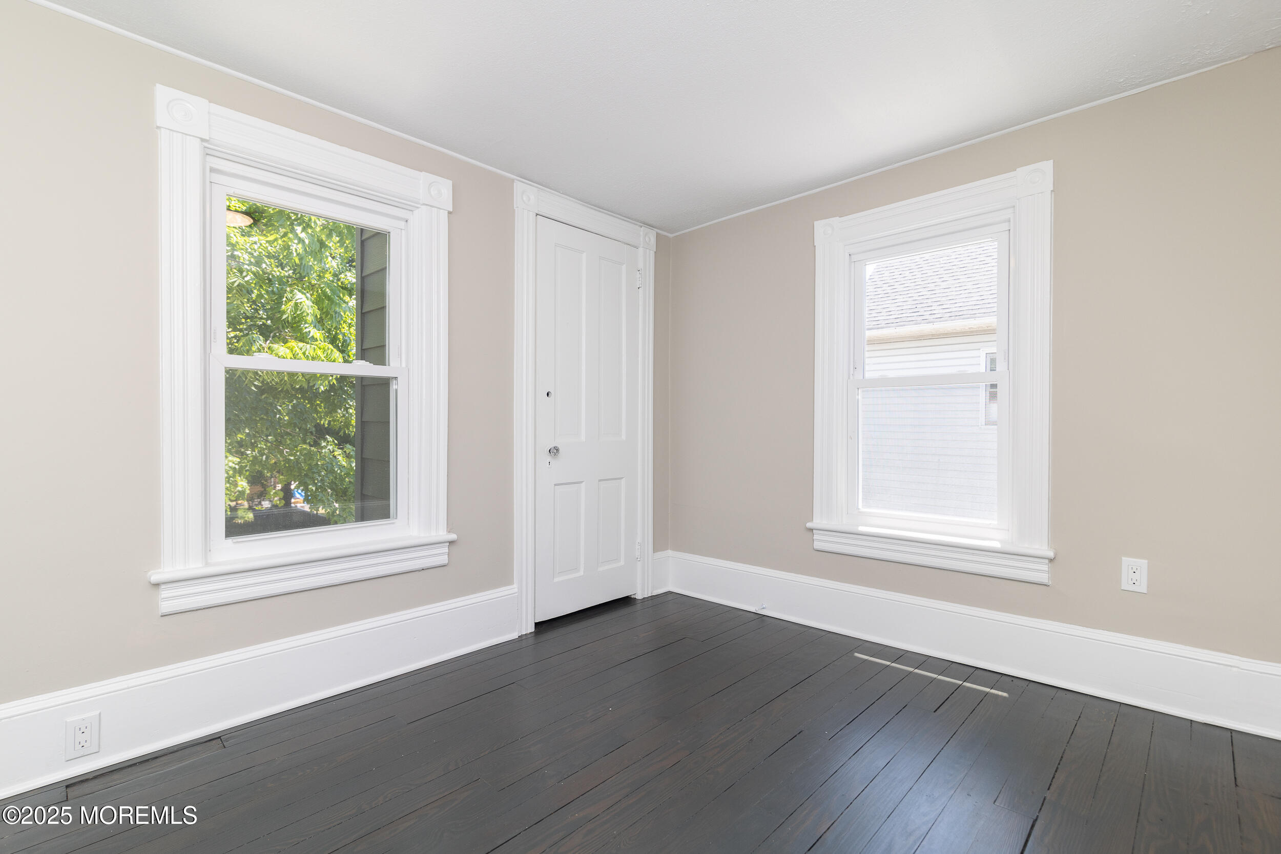 30 Conover Street Freehold, NJ 07728 - Photo 2 of 39 an empty room with wooden floor and windows
