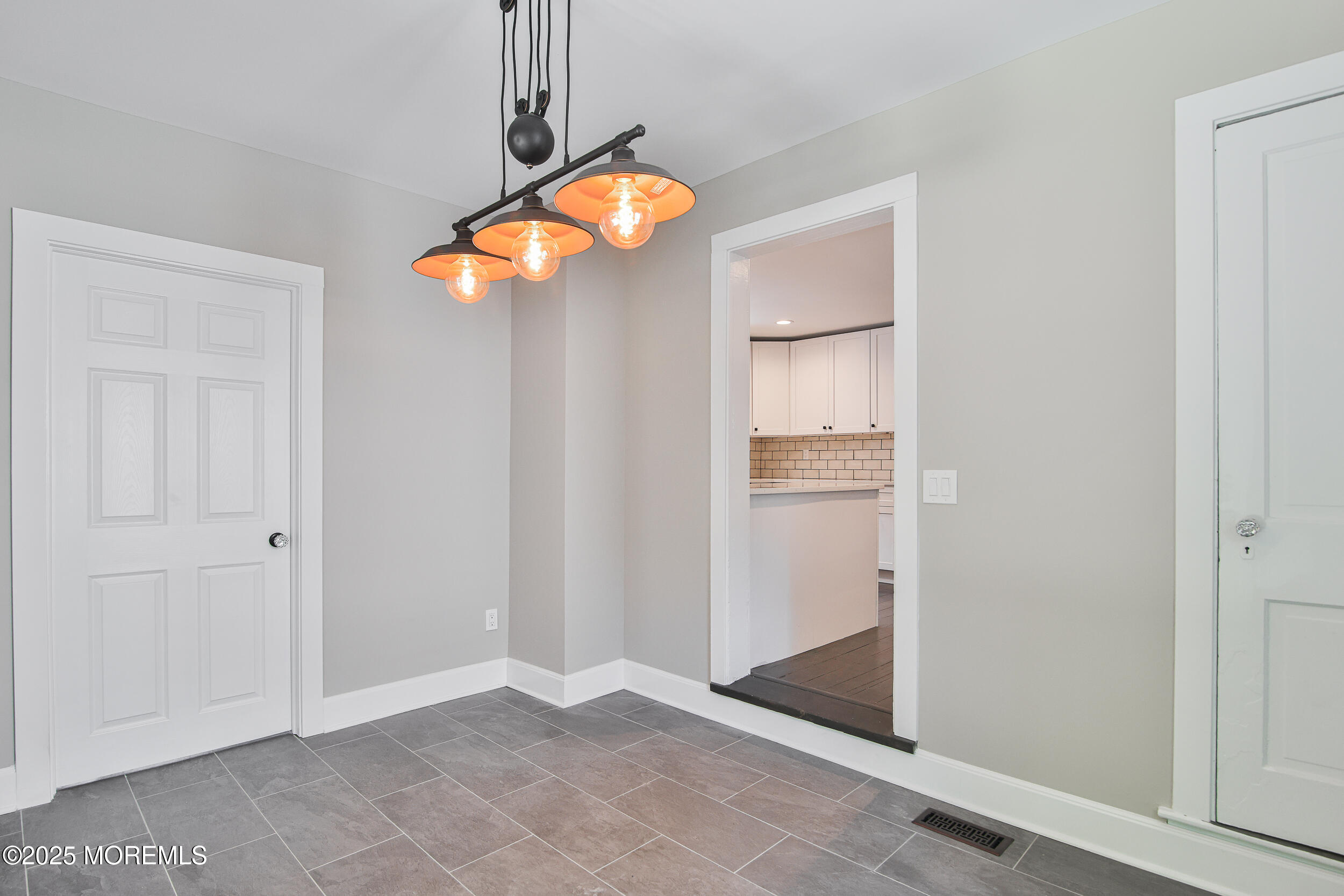 30 Conover Street Freehold, NJ 07728 - Photo 21 of 39 an empty room with windows and cabinet