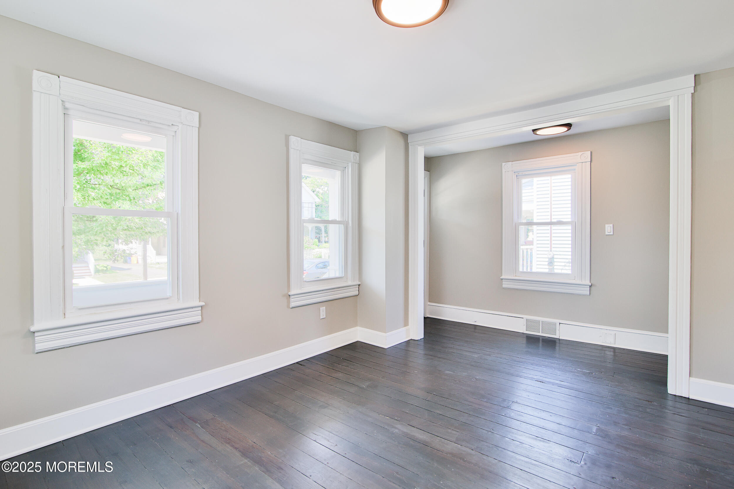 30 Conover Street Freehold, NJ 07728 - Photo 24 of 39 a view of an empty room with wooden floor and a window