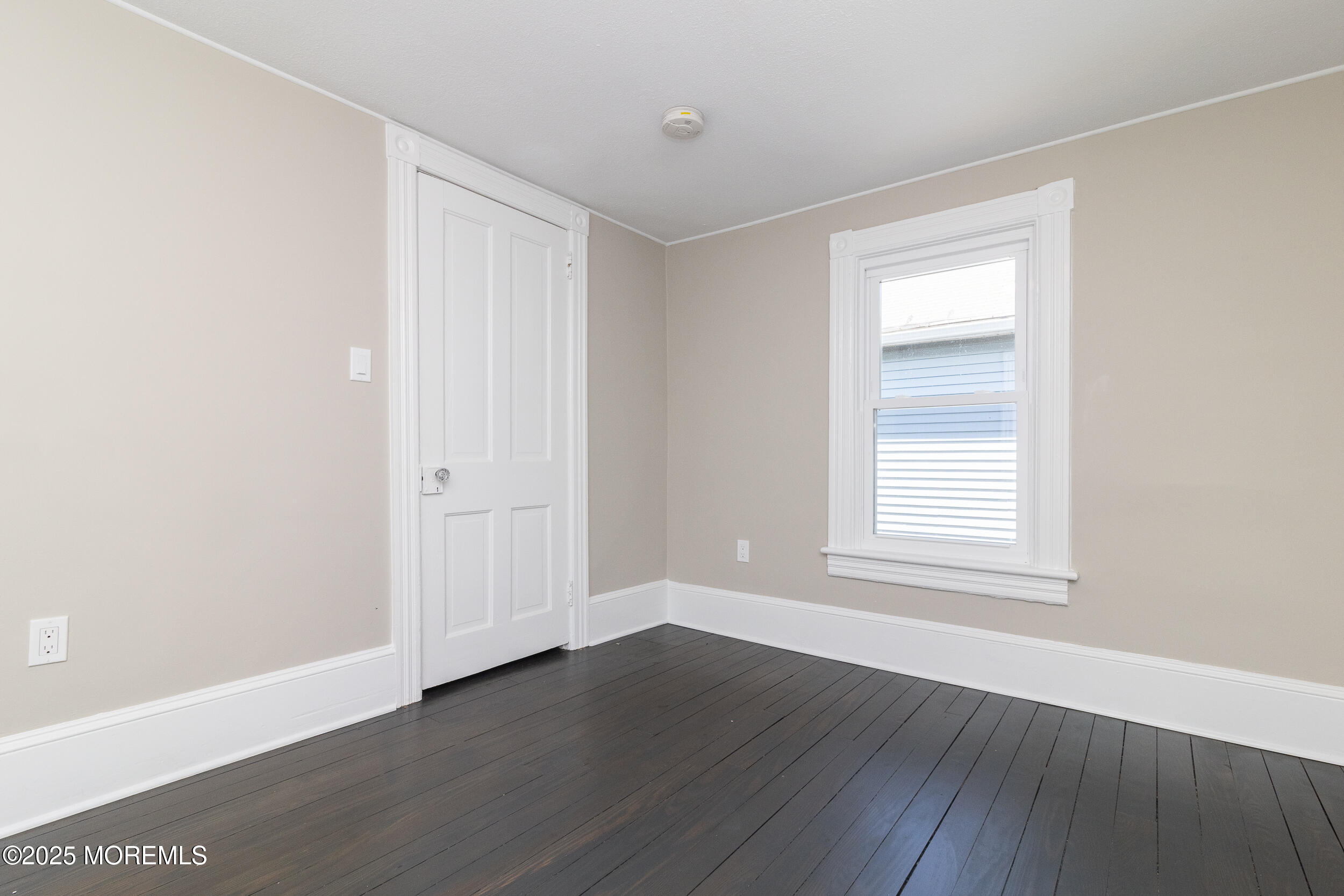 30 Conover Street Freehold, NJ 07728 - Photo 3 of 39 an empty room with wooden floor and windows