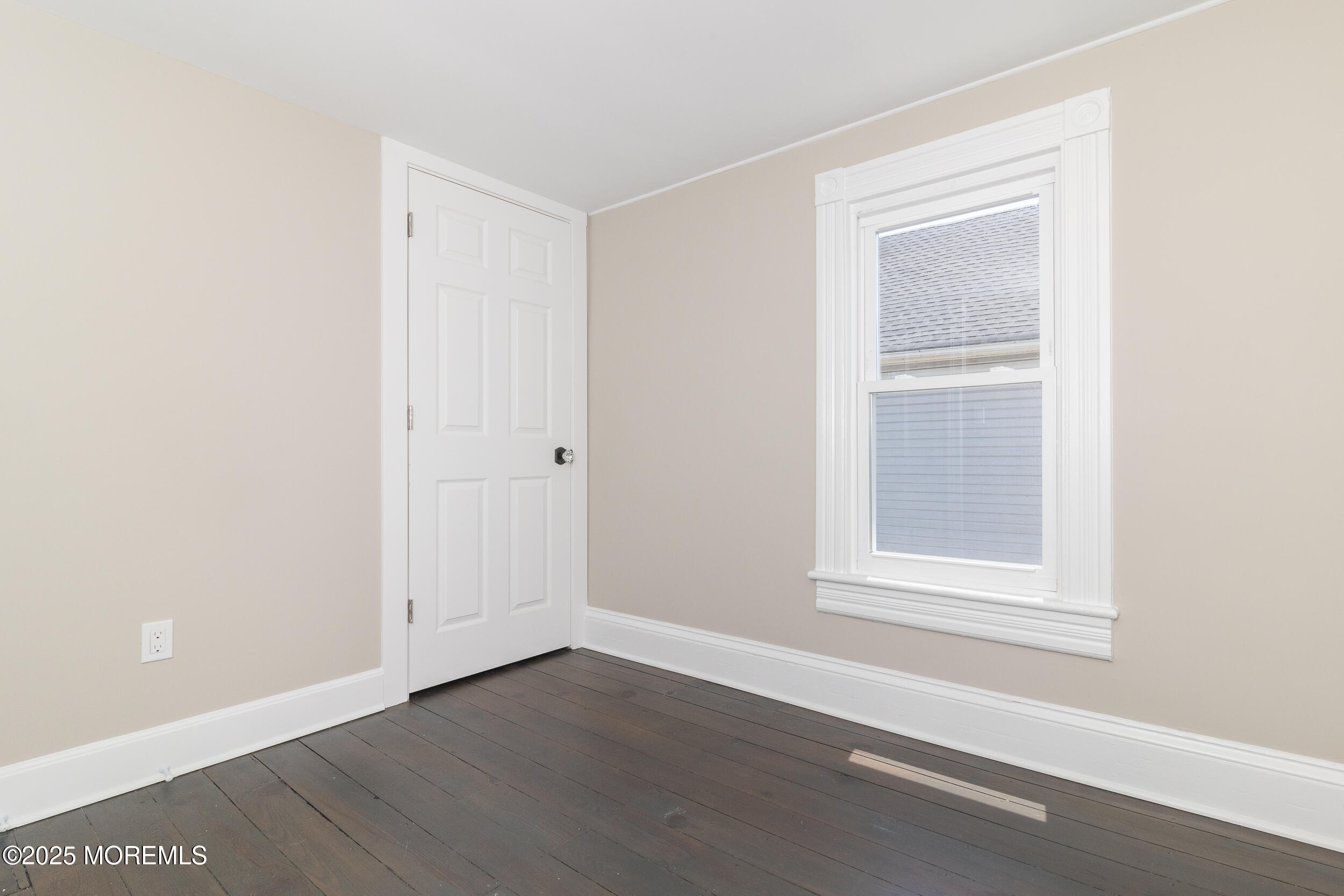 30 Conover Street Freehold, NJ 07728 - Photo 10 of 39 an empty room with wooden floor and windows