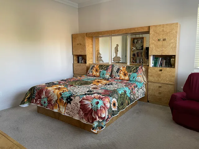 a bathroom with a double vanity sink toilet and mirror