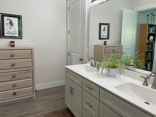 a bathroom with a sink and a window