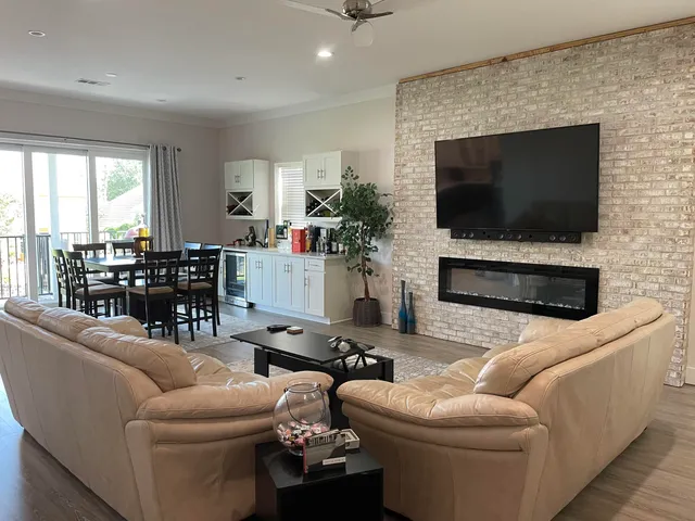 a view of a dining room with furniture and wooden floor