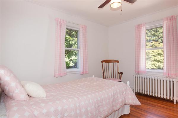 112 Cross Street Belmont, MA 02478 - Photo 15 of 22 a bedroom with a bed and a large window