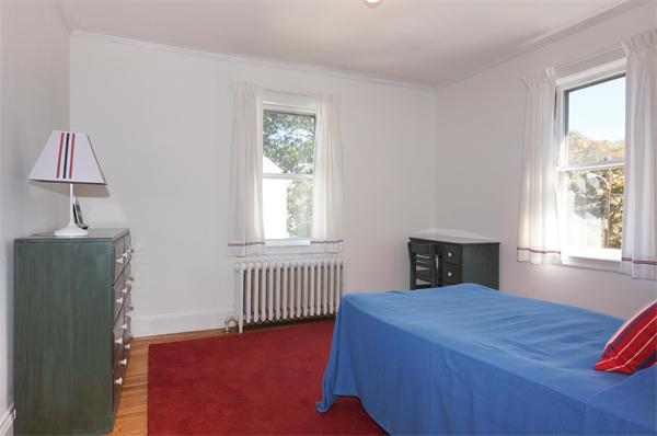 112 Cross Street Belmont, MA 02478 - Photo 16 of 22 a bedroom with a bed and a window