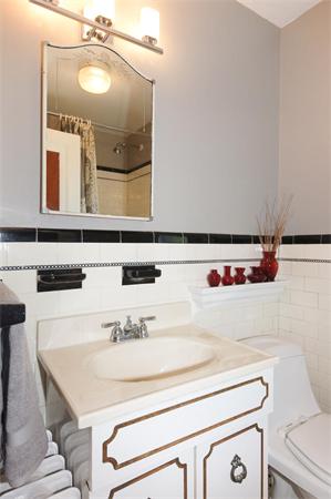 112 Cross Street Belmont, MA 02478 - Photo 17 of 22 a bathroom with a sink and a mirror