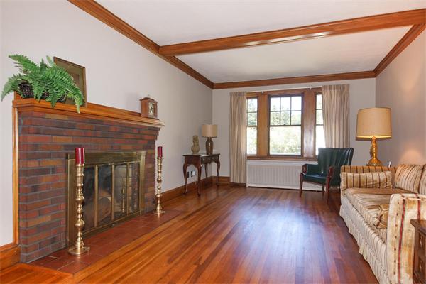 112 Cross Street Belmont, MA 02478 - Photo 2 of 22 a livingroom with fireplace and window