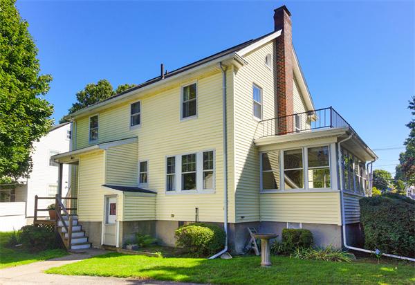 112 Cross Street Belmont, MA 02478 - Photo 21 of 22 a front view of a house with a yard and garage