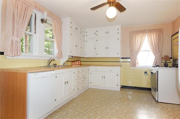 112 Cross Street Belmont, MA 02478 - Photo 7 of 22 a kitchen with cabinets a window and a sink