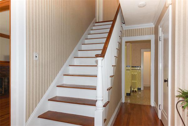 112 Cross Street Belmont, MA 02478 - Photo 10 of 22 a view of a hallway with wooden floor and entryway