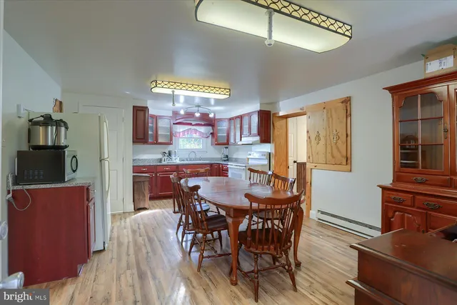 a kitchen with stainless steel appliances granite countertop a sink and cabinets