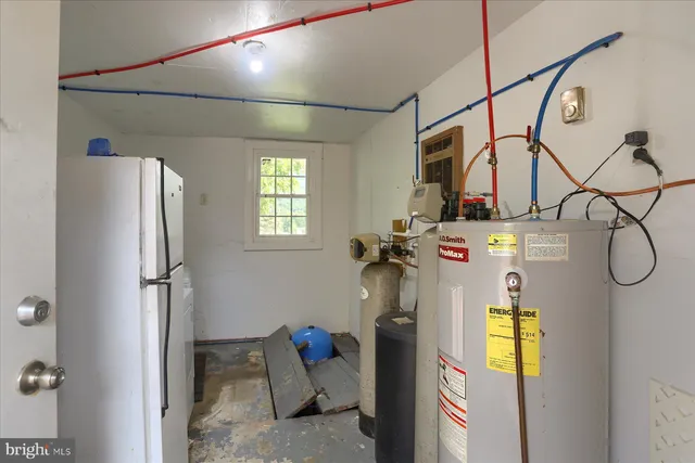 a bedroom with furniture and a window