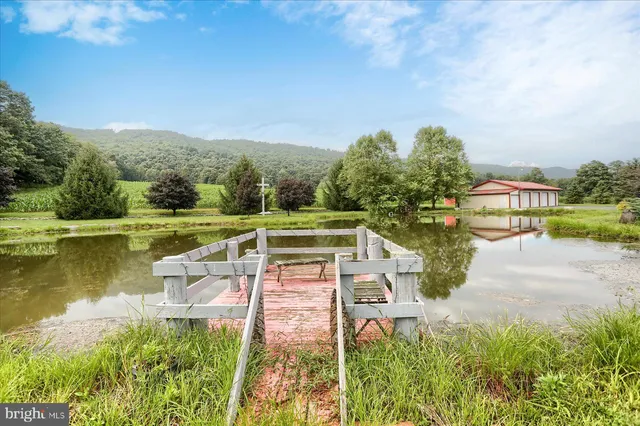 a view of a lake with a yard