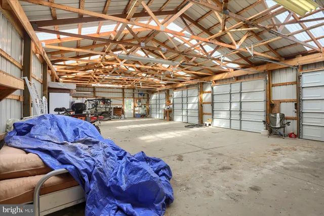 a view of a grassy field with trees