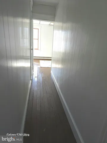 a view of wooden floor in an empty room
