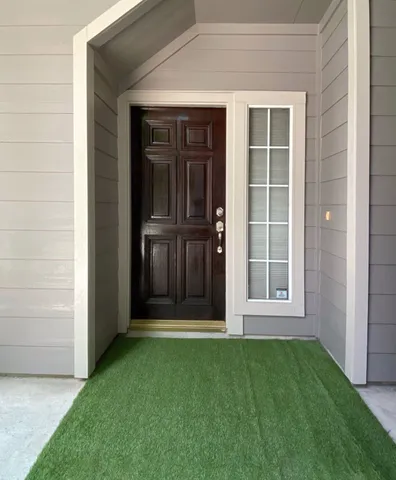 an entrance to house with yard