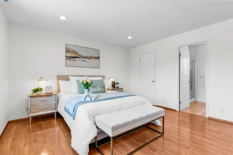 a bedroom with a bed and a table